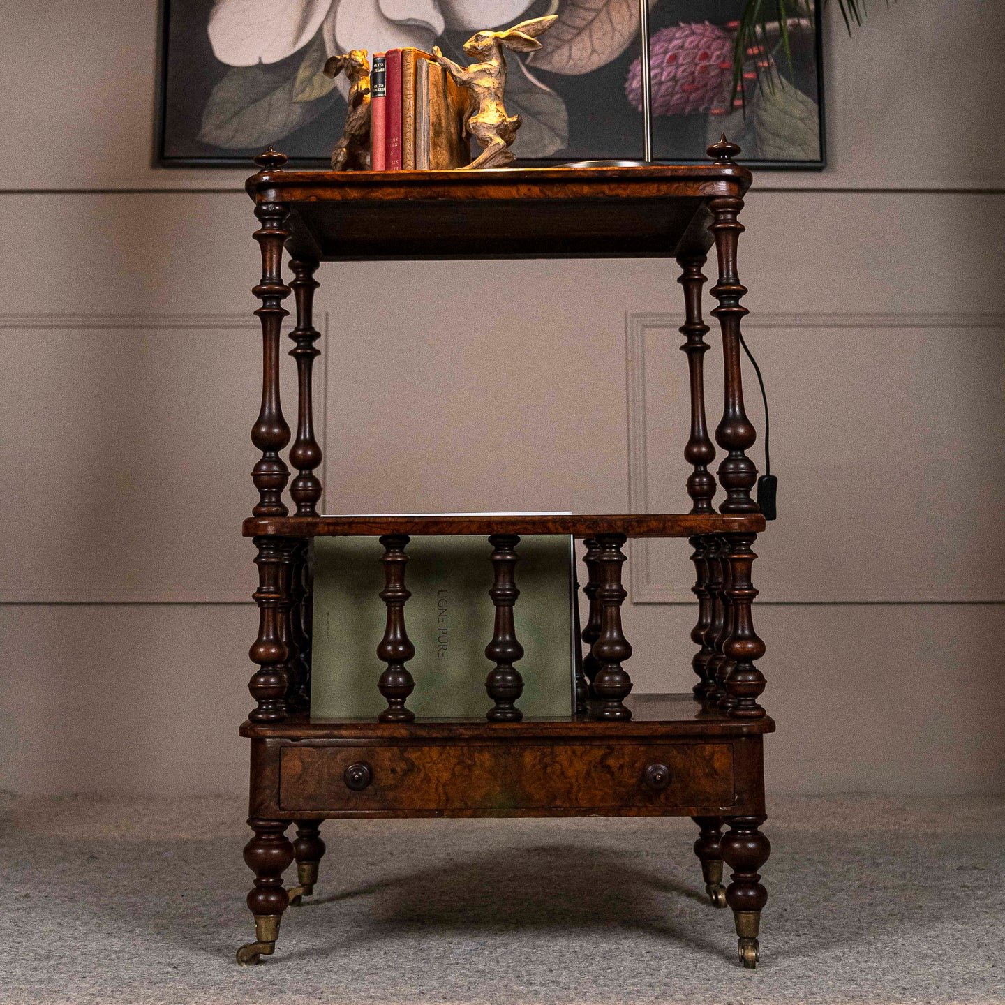 Burr Walnut Canterbury with drawer and brass castors